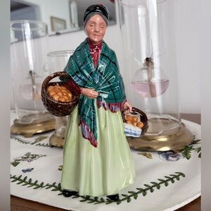 Vintage Royal Doulton porcelain piece titled "The Orange Lady".